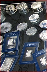 silver_coins_bars_on_shelf